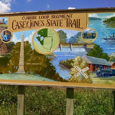 Mural painting on a trail sign for Currie Loop of Casey Jones Trail