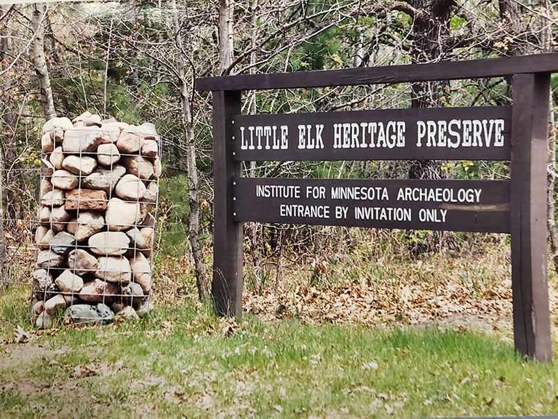 Wooden sign reads "Little Elk Heritage Preserve--Institute for Minnesota Archeaology"