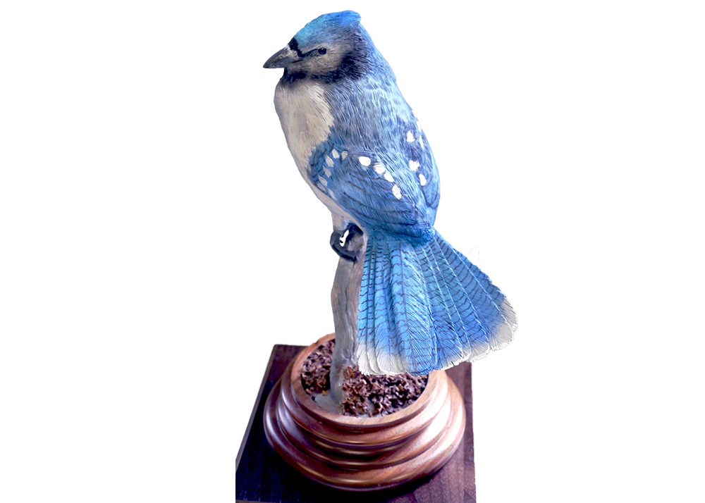 Carving of a bluejay on an award stand