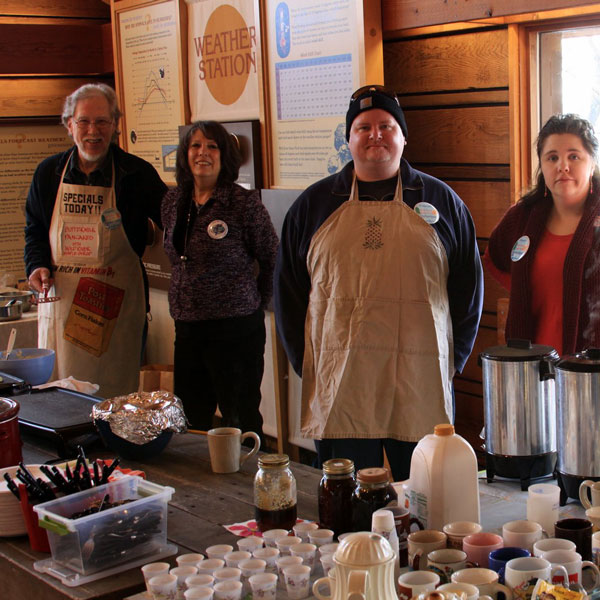 Group serving pancakes in the park visitor center