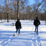 snow-shoers head out from the picnic shelter