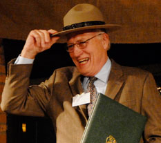 Man smiling and wearing a park ranger hat.