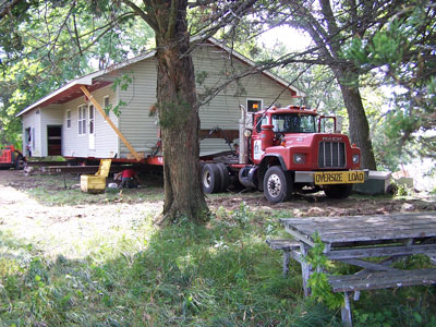Semi truck loading house for removal