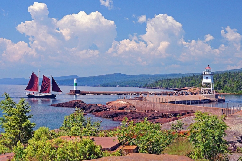 Iconic view of Lake Superior with ship and lighthouse fromGrand Marais