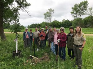 Oak savanna restoration project tree planting on June 2, 2018