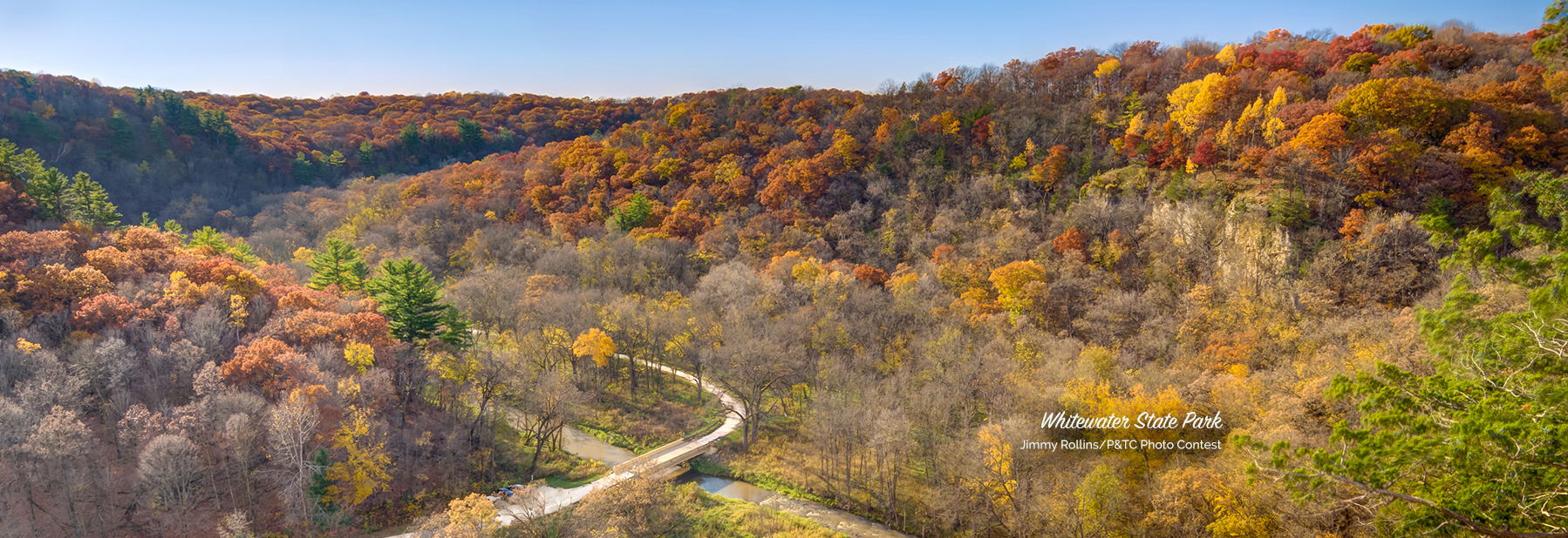 Landscape photo of the Whitewater valley with fall color bluffs