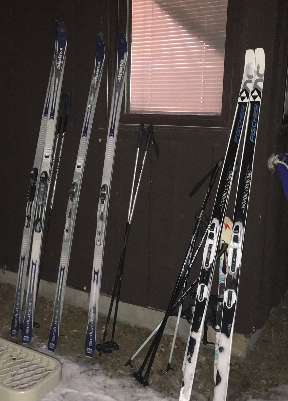 skis resting against the building