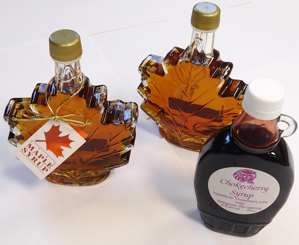 two bottles of maple syrup