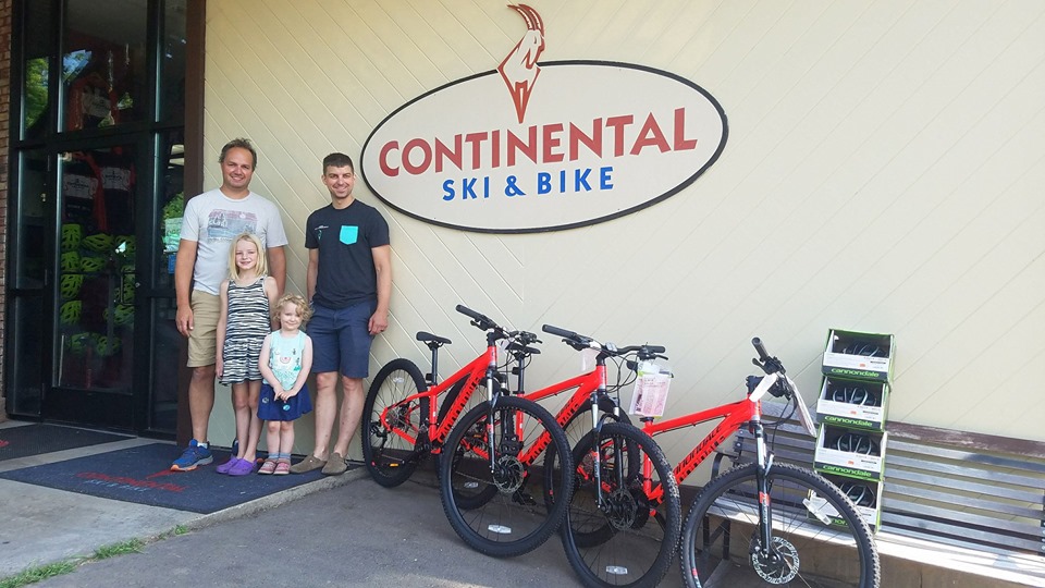 Bikes and people in front of Continental Ski & Bike Shop