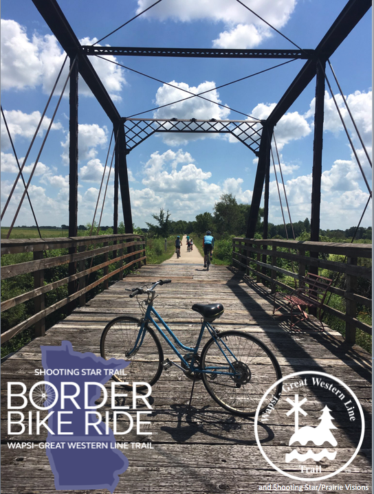 bike parked on a bridge with border bike ride logo