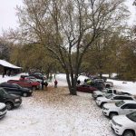 Cars parked in snowy lot