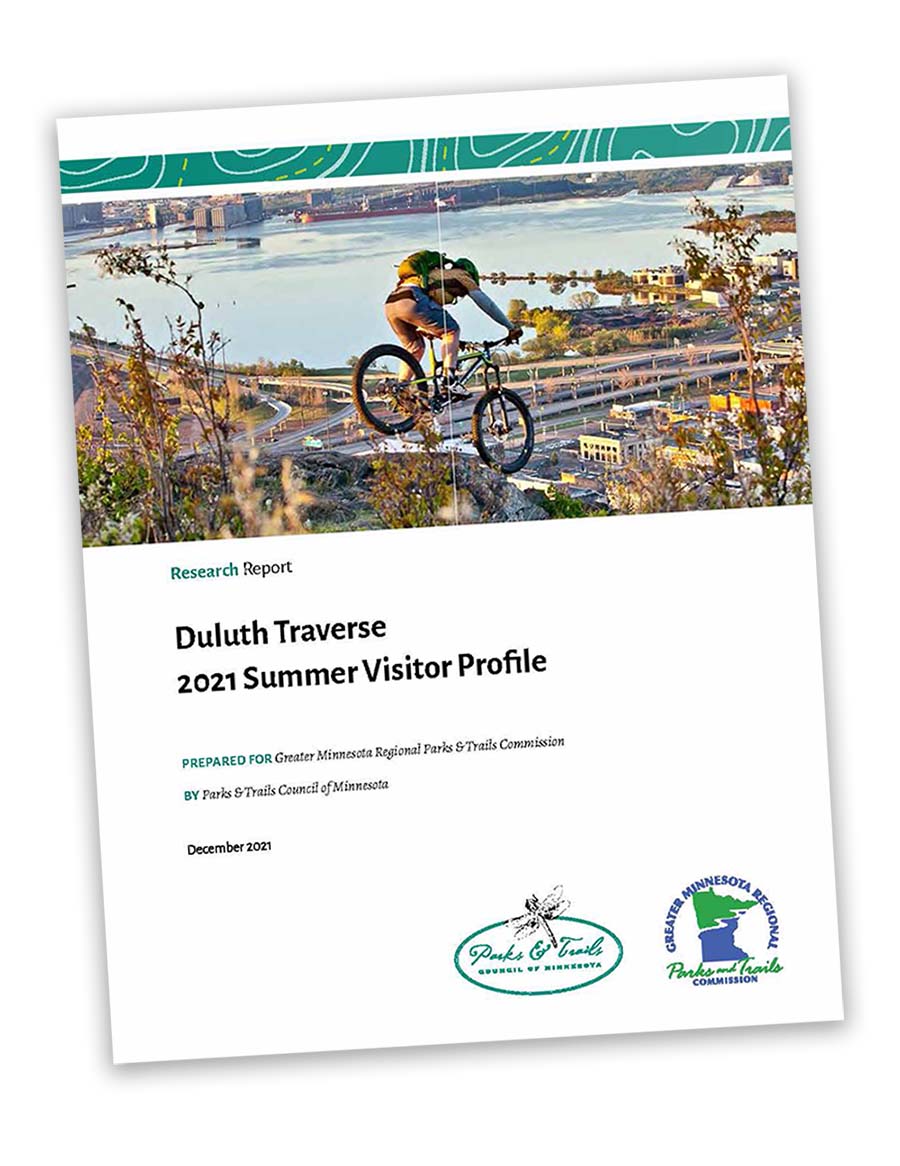 Cover of a Research Report shows mountain biker on hill with city in distance