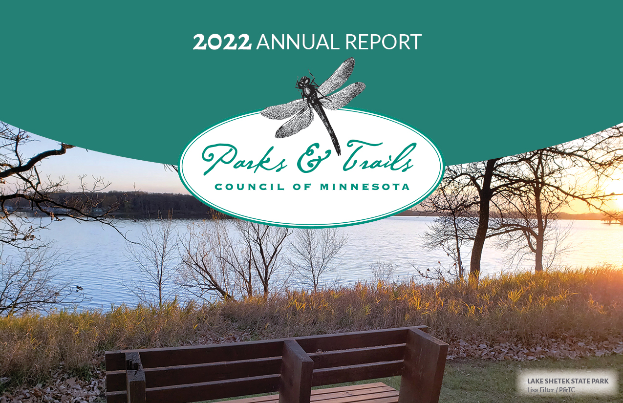 Report cover shows a bench overlooking a lake