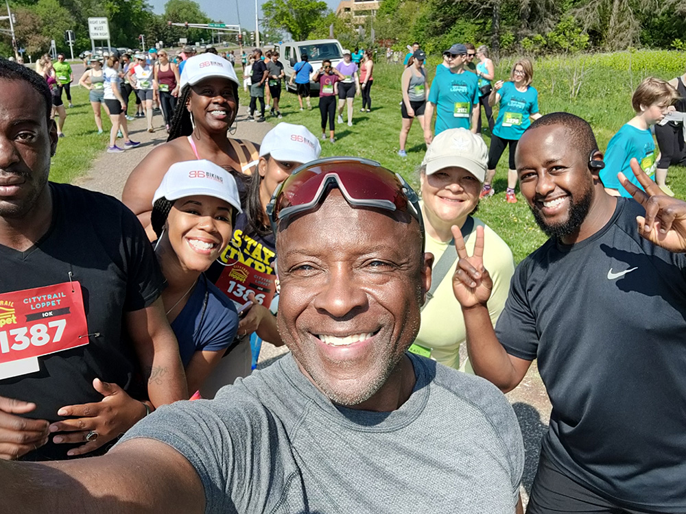 Selfie of Anthony Taylor surrounded by other Black people during an outdoor race