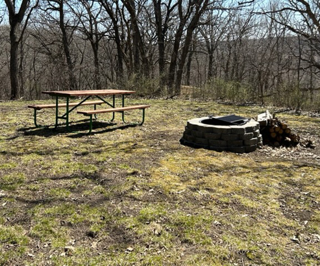 Picnic table next to a fire ring