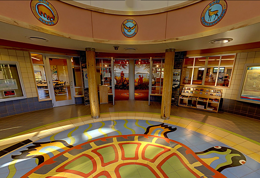 Interior view of the visitor center with a mosaic of a turtle on the floor