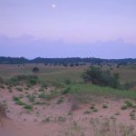 landscape with sandy plains and moon