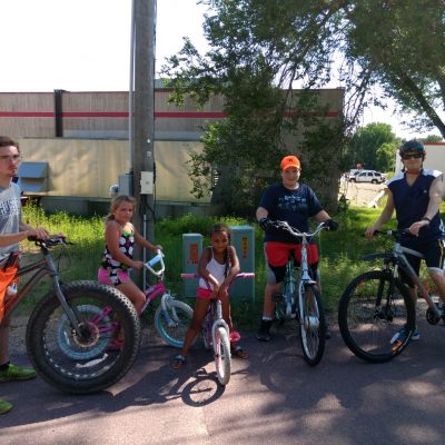 Kids pose for a picture on their bikes